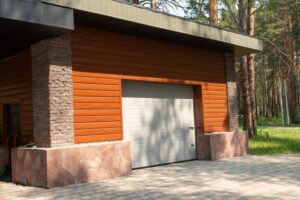 A closed garage door on a modern building with wood and stone finishes