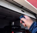 man holding the remote for the garage door