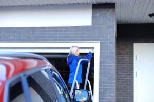 woman checking on her garage door