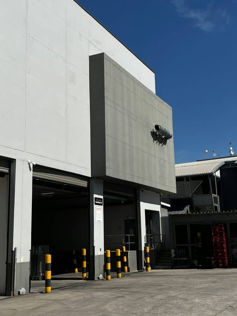 Modern industrial building exterior with loading docks