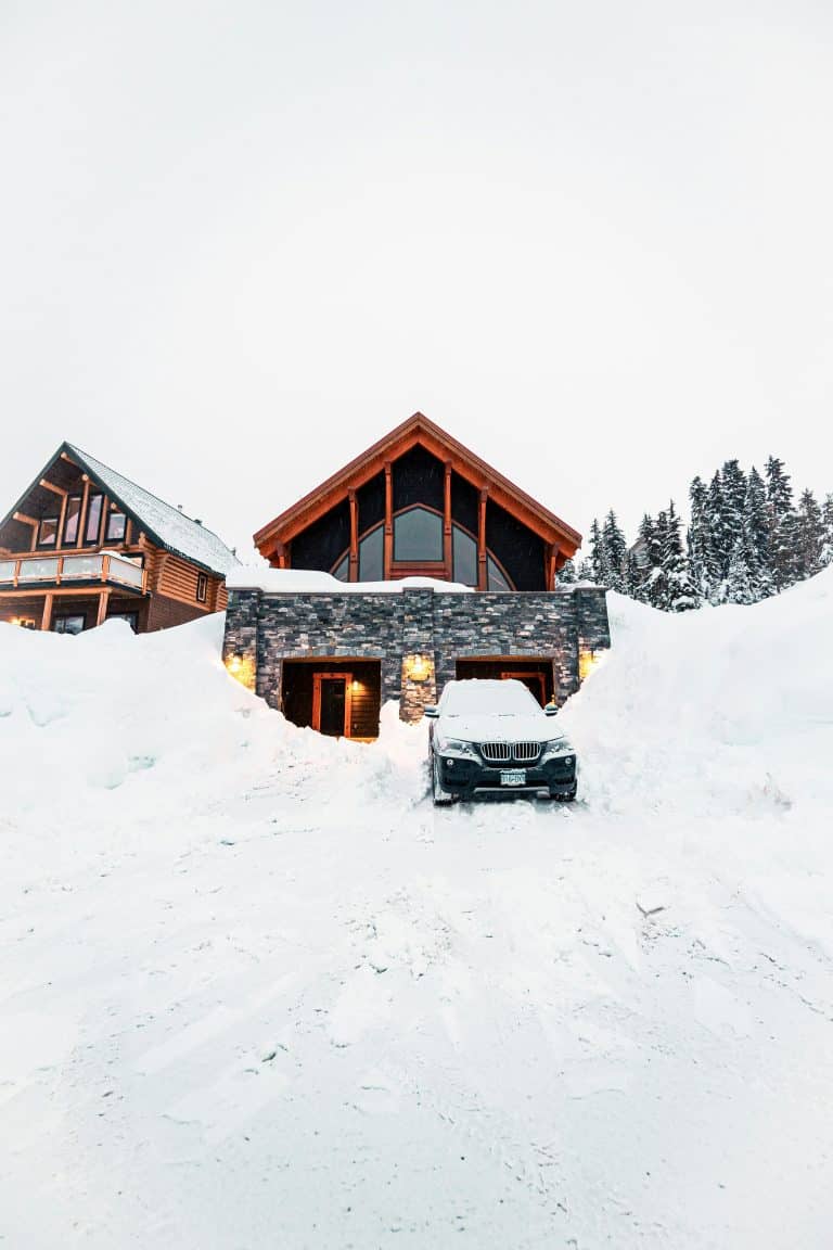 House and car in deep snow