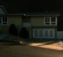 Suburban house with a garage and manicured bushes