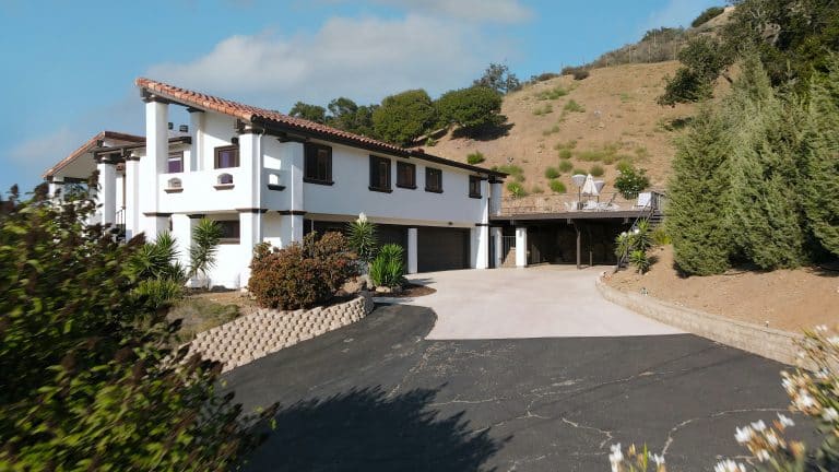 Large white house with a driveway