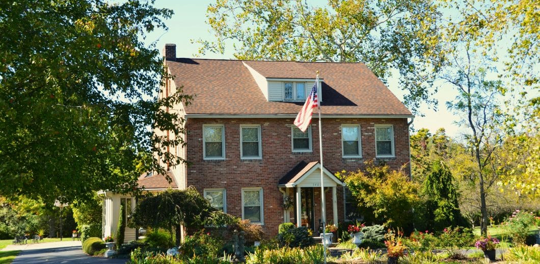 Brick house with a flag in front