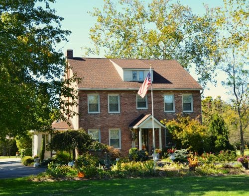 Brick house with a flag in front