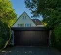 House with a large dark garage door