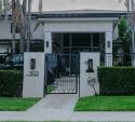 Modern house with manicured hedges and gate