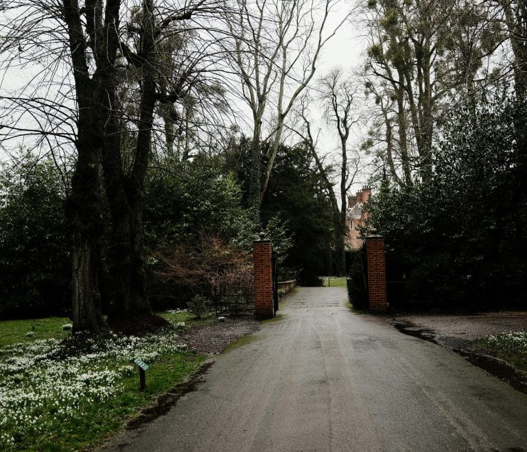 Pathway leading to a brick gate and building