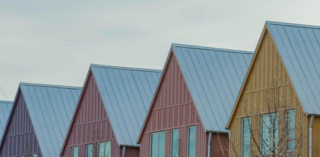 Row of modern houses with gabled roofs