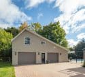 Family home exterior with garage and backyard pool