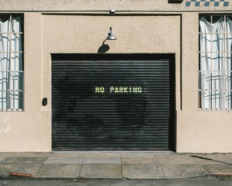 Black metal roll-up garage door