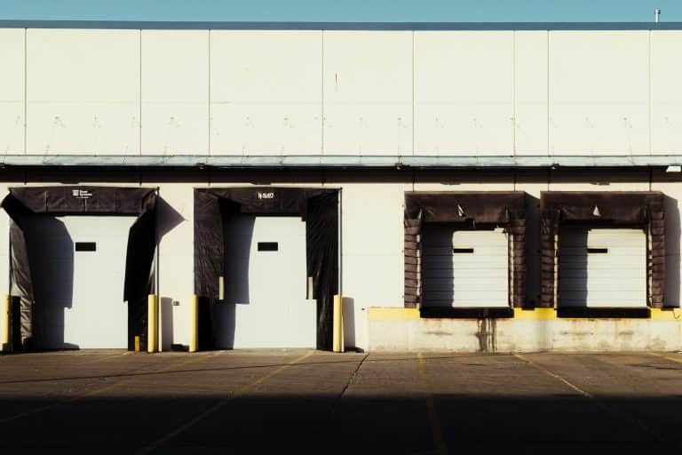 Row of loading dock doors on a commercial building