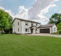 White two-story house with a garage