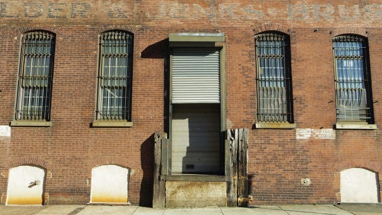 Brick building with a closed door