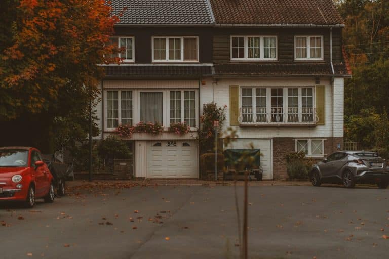 Autumn trees framing a home garage door on a cool fall morning
