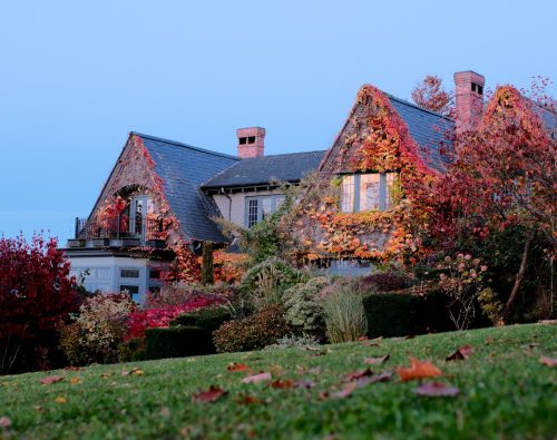 Home covered in bright fall foliage as the season turns cold