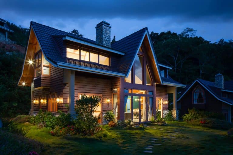 Mountain style home at dusk in cold weather