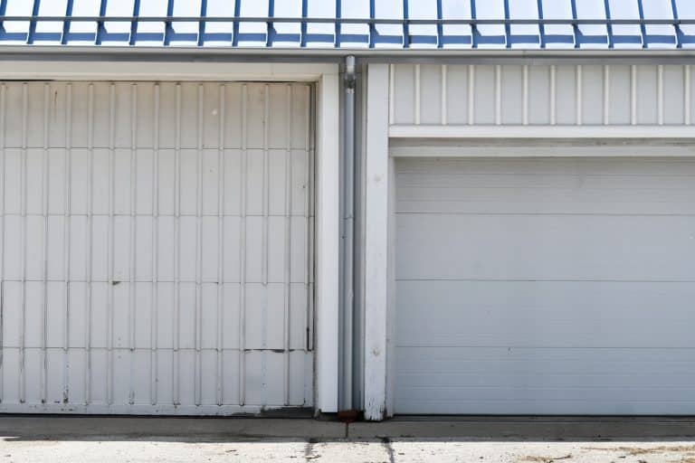 Older and newer white garage doors side by side