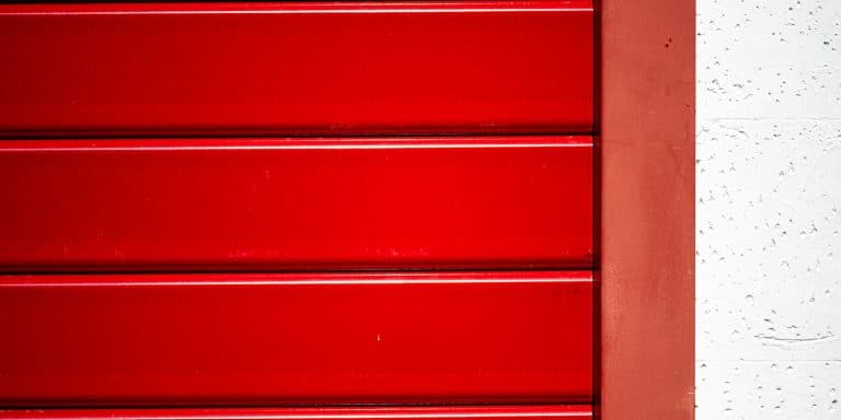 Ribbed metal garage door surface in bright light