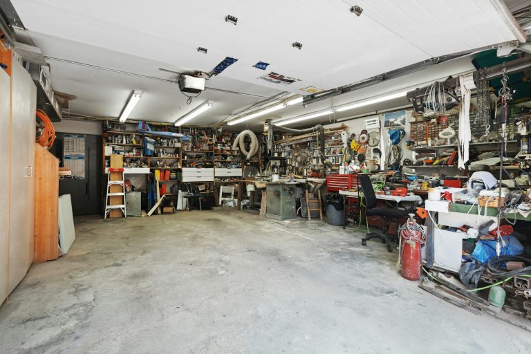 Garage interior where hinges and rollers get seasonal attention