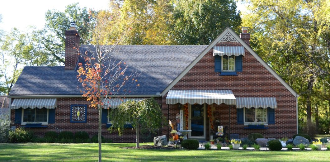 Tidy brick home with early fall color in the front yard