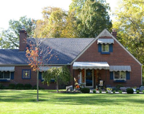 Tidy brick home with early fall color in the front yard