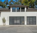 Modern home with two glass panel garage doors ready for fall in Lakewood, CO