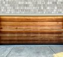 Wood panel garage door on a well kept home in Lakewood, CO