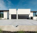 Modern white homes with wide black garage doors