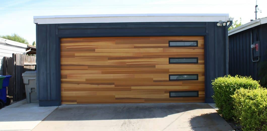 Modern wood panel garage door on a Parker area home