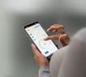 Hands using a smart home control app on a phone